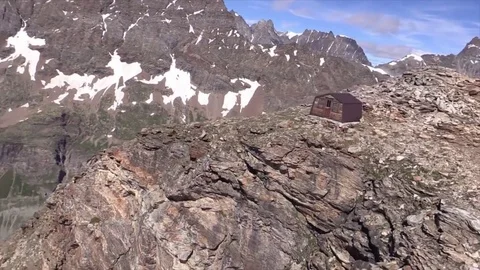 Small refuge on top of a mountain Stock Footage 79753875