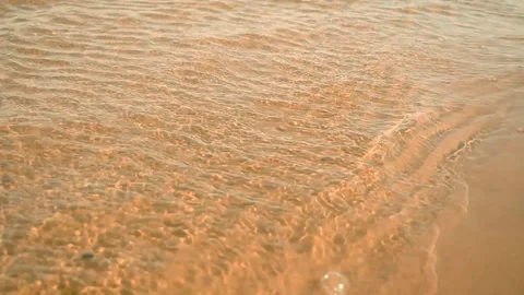 Small relax ocean waves. Slowly splash on sandy coast with meditating motion Stock Footage 122849675