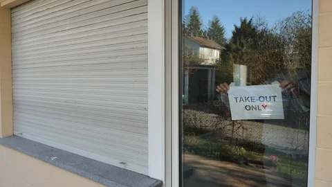 Small Restaurant Owner Puts Up Take Out Only Sign On Front Door, Coronavirus Stock Footage 127704660