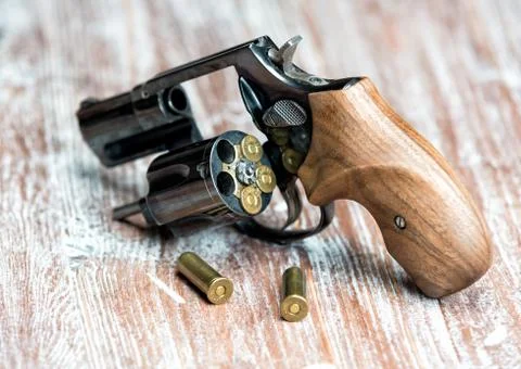 Small revolver lying on a  table 库存照片