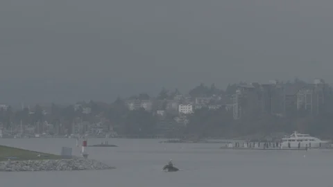 Small rib boat sails down river into Victoria City Harbor BC Stock Footage 127043741