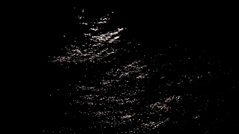 Small ripples of light on black water Stock Footage 77862779