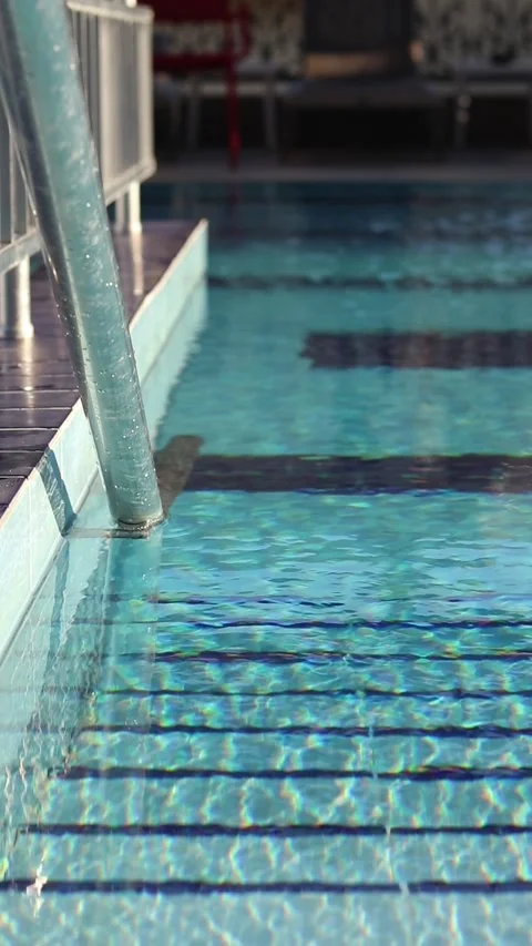 Small ripples on the surface of the water in the pool. Swimming pool Video stock 315461613
