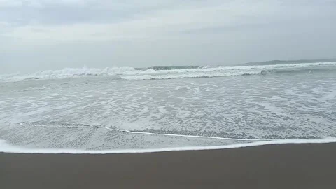 Small ripples of waves on the beach Video stock 228890445