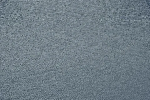 Small ripples from a weak wind on the water surface of the Ural river Sylva Stock Photos