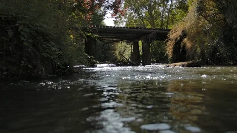 Small river and old bridge Stock Footage 124977323