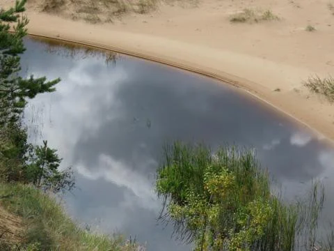 Small river on beach Stock Photos