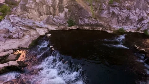 A Small River In The City Center. A River And Rocks. A small City River. Stock Footage 154196476