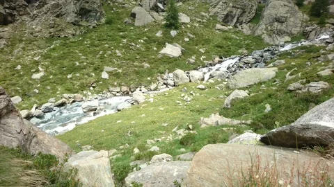 Small river coming down the Alpe Gera dam in northern Italy. Stock Footage 91224251