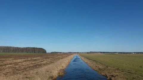 Small river in the field Stock Photos