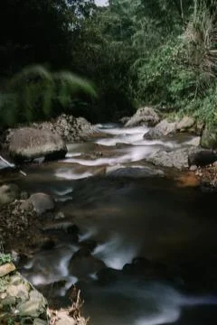 A small river with a flow that is not strong can be enjoyed by many people .. Stock-Fotos