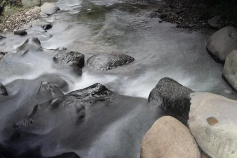 A small river with a flow that is not strong can be enjoyed by many people .. Stock-Fotos