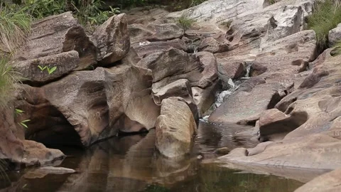Small river flowing through a rocky landscape, Natividade, Tocantins Stock Footage 317790181