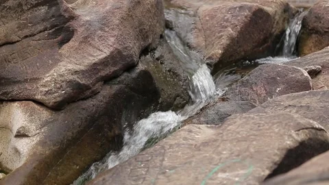 Small river flowing through a rocky landscape, Natividade, Tocantins Stock Footage 317790187
