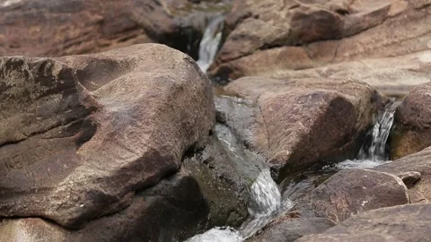 Small river flowing through a rocky landscape, Natividade, Tocantins Stock Footage 317790193