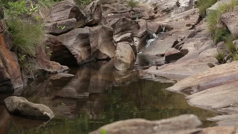 Small river flowing through a rocky landscape, Natividade, Tocantins Stock Footage 317790223