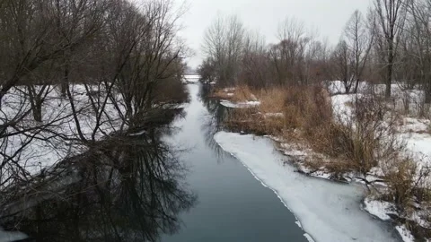 A small river flows in the winter. aerial shooting Stock Footage 147509486