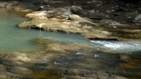 A small river in the mountains that is clear and shallow 스톡 동영상 336844171