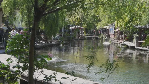 A small river in the old town of Shuohe in Lijiang Stock Footage 148517784