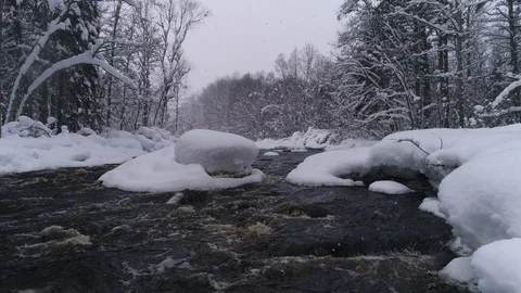 Small river in a snowy forest Stock Footage 105072515