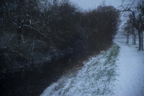 Small river in snowy forest Stock Photos