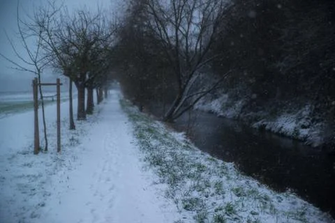 Small river in snowy forest Stock Photos