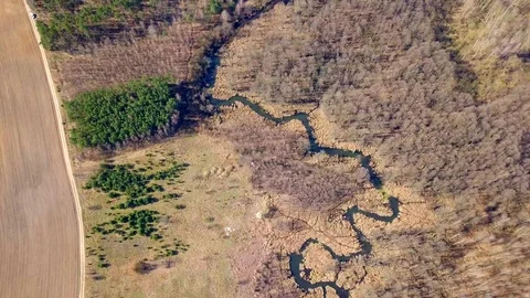 Small river in spring landscape. Aerial video 스톡 동영상 128329486