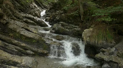 Small river streaming over rocks Stock Footage 56162427