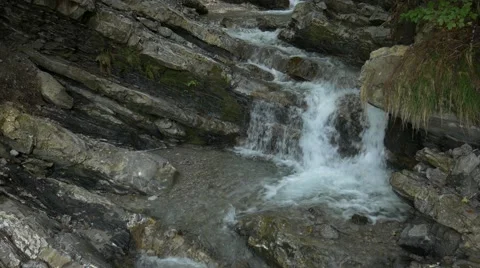 Small river streaming over rocks Tilt Stock Footage 56163442