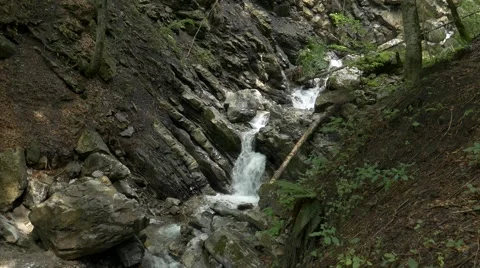 Small river streaming in rocky river bed Stock Footage 56164891