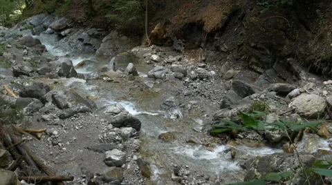 Small river streaming in rocky river bed Stock Footage 56165109