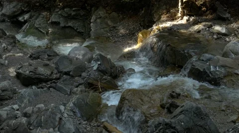 Small river streaming in rocky river bed Stock Footage 56165247