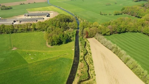 Small river streaming trough typical green Dutch landscape Video stock 111664897