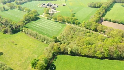 Small river streaming trough typical green Dutch landscape Video stock 111665360