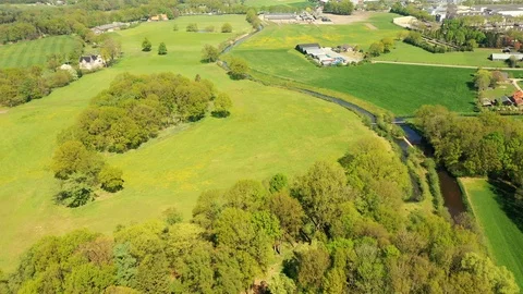 Small river streaming trough typical green Dutch landscape Video stock 111665461