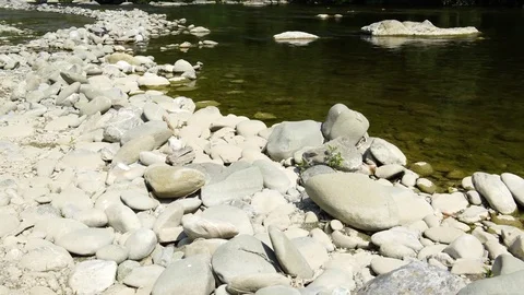 A small river with transparent water and stoned shore Stock-Footage 76110398