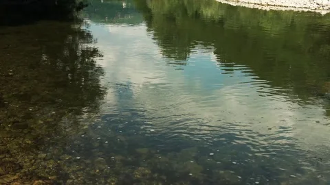 A small river with transparent water and stoned shore, 4K 스톡 동영상 76158601