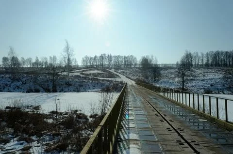 A small river under the ice on a clear day Stock Photos