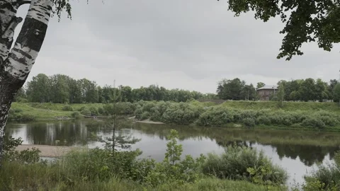 A small river, view from the shore, slow motion camera Video stock 328315310