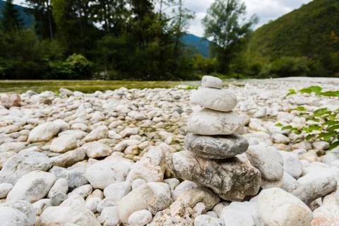 Small river with white round stones on the riverbanks in the Triglav National Stock Photos