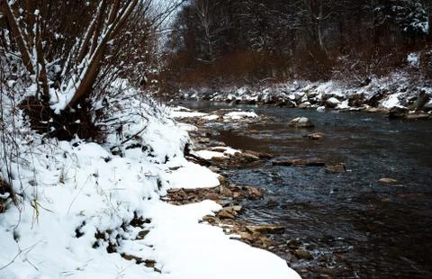 A small river in a winter landscape Stock Photos