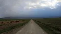 Small road between fields view to foggy Harz mountain range landscape 4k or 4k+ Resolution
