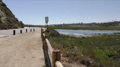 Small road bike path by back bay a California estuary. Stock Footage 67580751