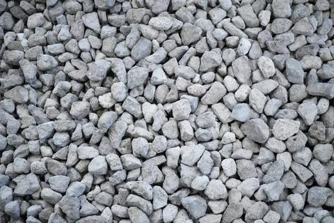 Small road stone background, dark gravel pebbles stone texture seamless textu Stock Photos