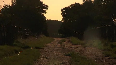 Small road with a sunset in the spring Zoom out. Video stock 34288672