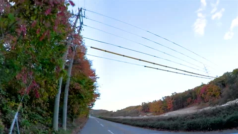 The small road with the view of the mountains on the side Stock Footage 139332537