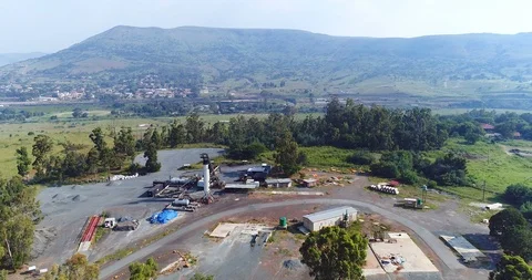 Small roadwork depot on top of hill minor industrial site 4K aerial Stock Footage 85953634