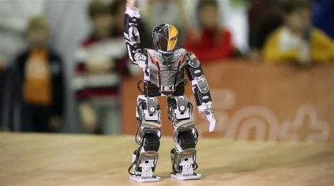 A small robot android dances Stock Footage 46891082
