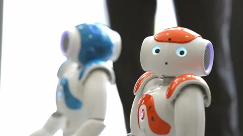 Small robots with human face and body. AI Stock Footage 66460465