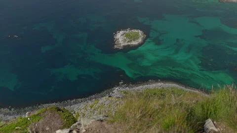Small Rock Island in Clear Turquoise Coastal Water, Norway Lofoten Stock Footage 340575014